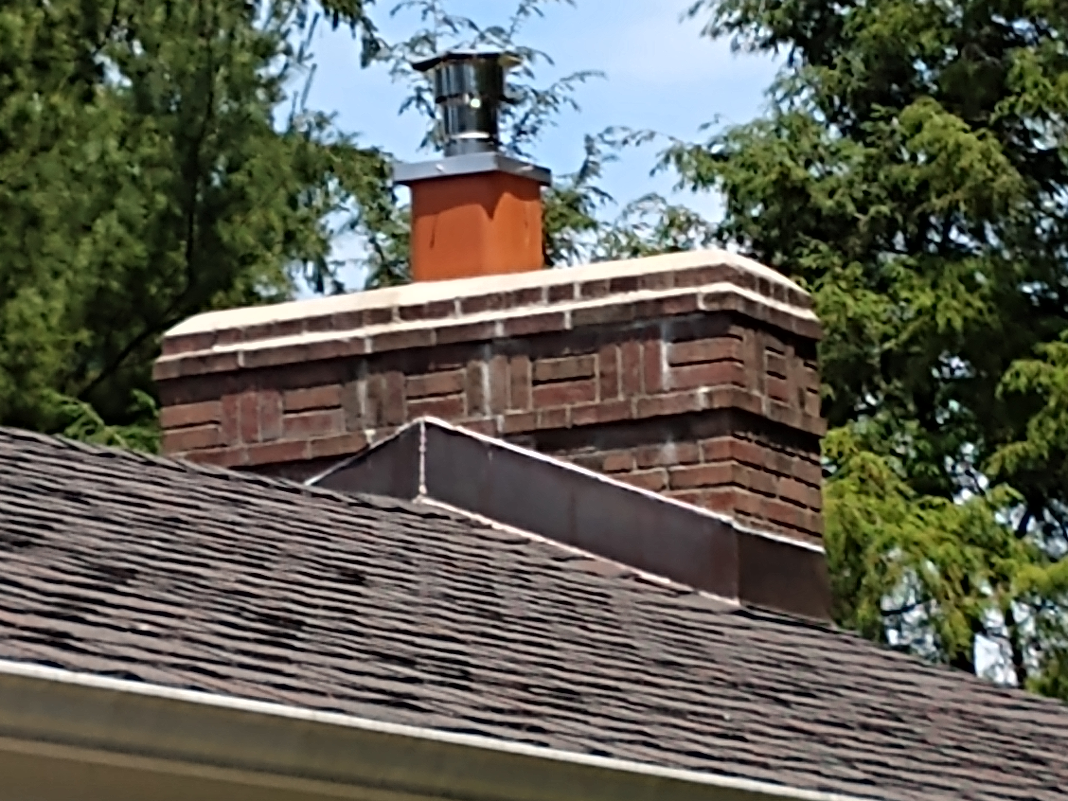 Stainless steel chimney cap with animal guard in Wantagh, New York